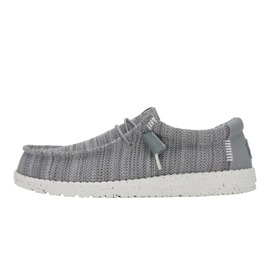 Gray knit shoe with white sole on a white background