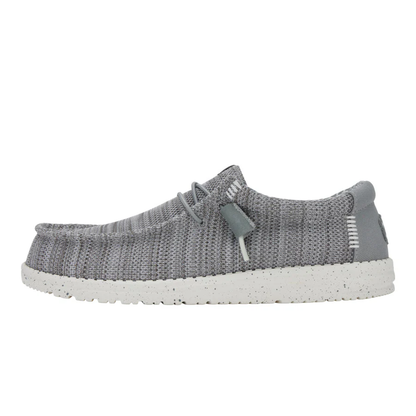 Gray knit shoe with white sole on a white background